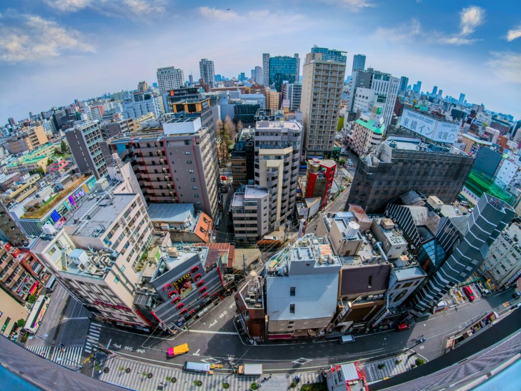 Vibrant aerial view of Tokyo's urban architecture and bustling streets.